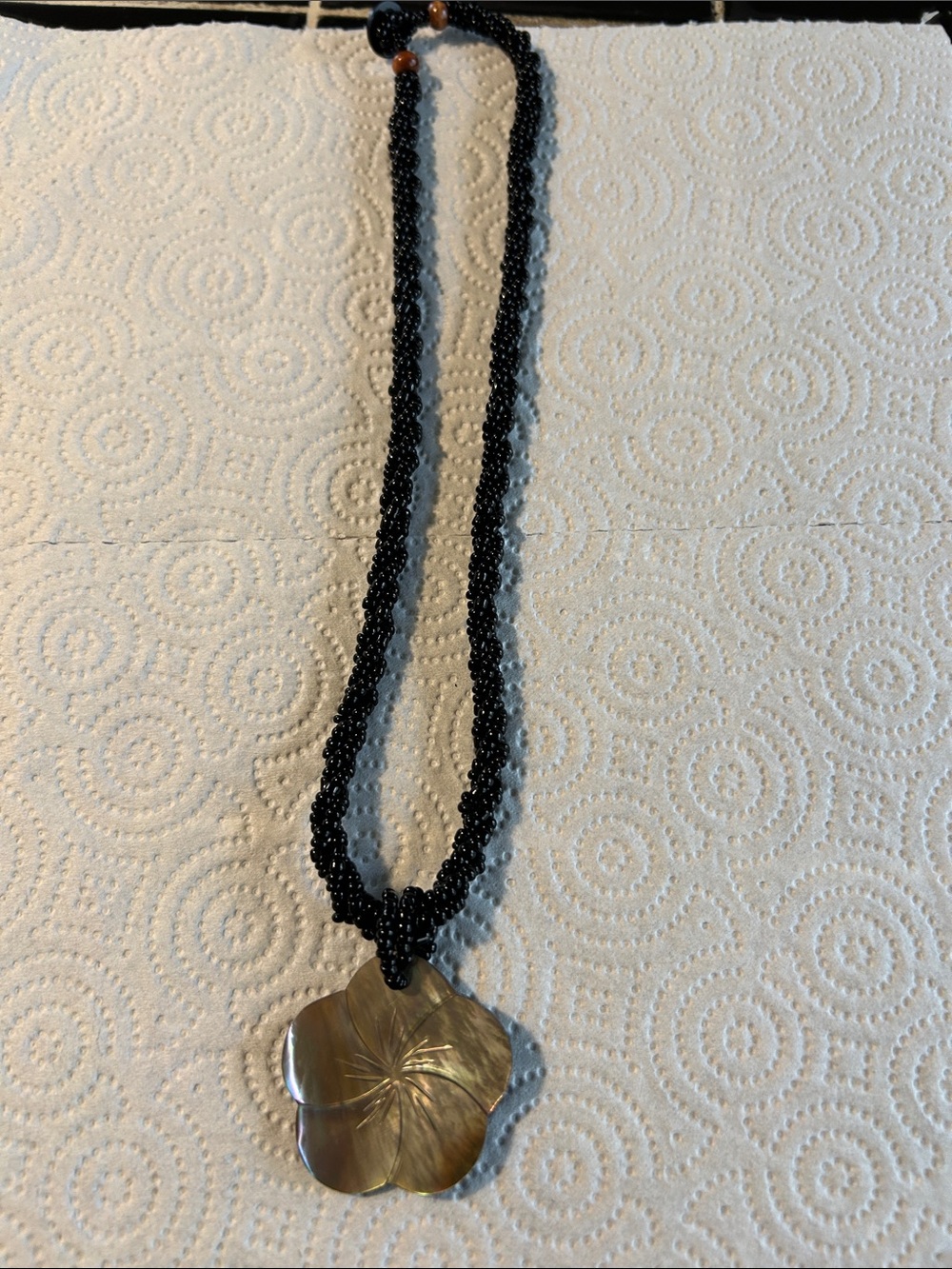 Black Beaded Necklace with Gold Floral Shell Pendant